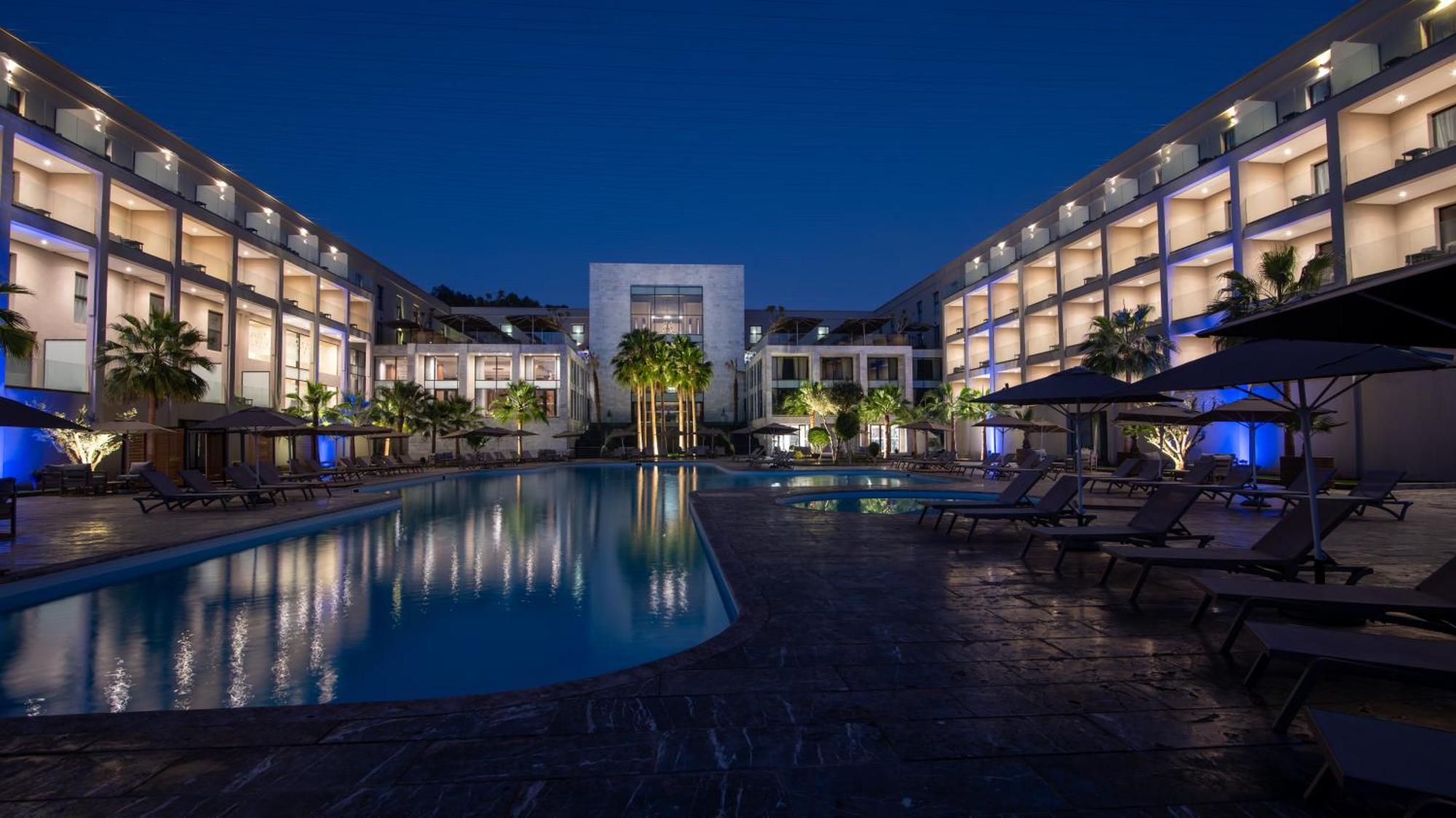 Dominium Palace Agadir Bagian luar foto The hotel at night